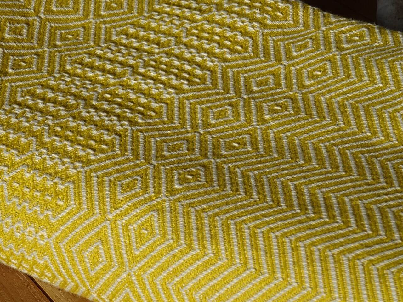 Mungo Bakuba Throw Wohndecke "Turmeric"